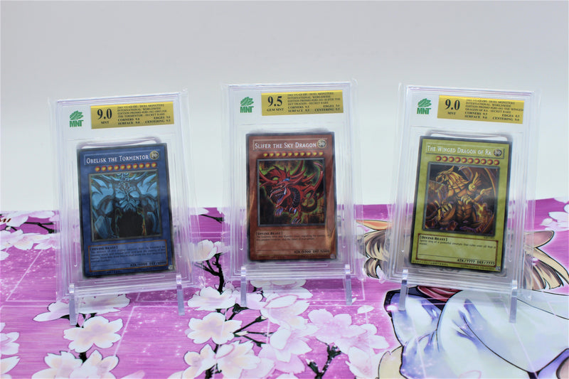 Obelisk the Tormentor, Slifer the Sky Dragon & The Winged Dragon of Ra - MNT 9.0, 9.5, 9.0